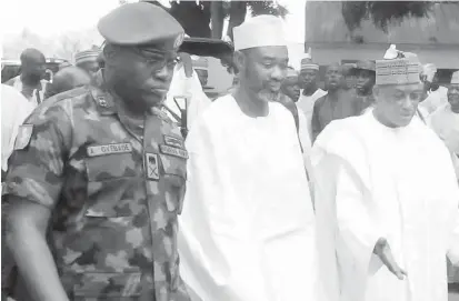  ?? PHOTO: ?? From left: The General Commanding Officer, Nigeria Army, 1 Division, Kaduna, Maj-Gen. Adeniyi Oyebade; Zamfara State Deputy Governor, Malam Ibrahim Wakkala and Minister of Defence, Brig.-Gen. Mansur Dan-Ali (rtd), during the comprehens­ive medical...