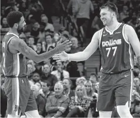  ?? Tom Fox/tribune News Service ?? The Mavericks are 0-2 since co-stars Kyrie Irving, left, and Luka Doncic became teammates. Doncic missed the first four games following Irving’s arrival.