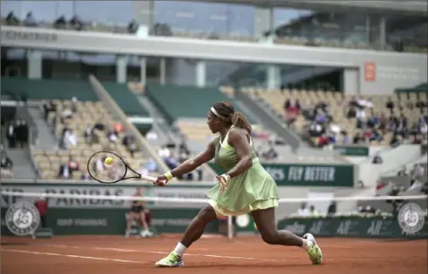  ?? Associated Press ?? Serena Williams plays a return to Danielle Collins in their third-round match Friday at Roland Garros in Paris.