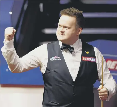  ??  ?? 0 Shaun Murphy celebrates after winning the last two frames to reduce his arrears to 10-6 in his semi-final against Kyren Wilson