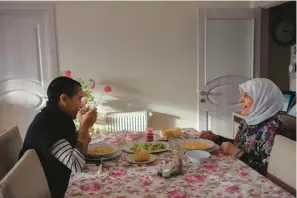  ?? GRANDMAS PROJECT ?? Director Zeynep Dilara, left, and her grandmothe­r Munise Bostanci sit down to eat simmered bulgur wheat with potato and onion.