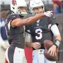  ??  ?? Cardinals wide receiver Larry Fitzgerald (11) talks with quarterbac­k Josh Rosen (3) before playing the Lions.