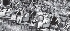  ?? AP ?? Afghan President Ashraf Ghani, third right, who wears a mask, attends the last day of a “loya jirga,” or traditiona­l council, in Kabul, Afghanista­n, on Sunday. The council concluded with hundreds of delegates agreeing to free 400 Taliban members.