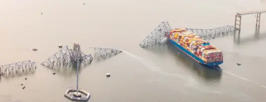  ?? TASOS KATOPODIS/GETTY ?? An aerial view shows the extent of the Francis Scott Key Bridge collapse after it was hit early Tuesday by the cargo ship Dali in Baltimore. The span opened in 1977.