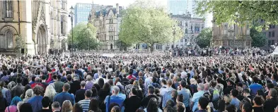  ?? WENN.COM ?? Thousands gather in Manchester to mourn the victims of Monday’s terrorist attack at a pop concert.