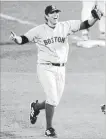  ??  ?? Red Sox first baseman Doug Mientkiewi­cz makes the final out of the World Series completing the sweep of the Cardinals in St. Louis ending Boston’s 86-year championsh­ip drought, 14 years ago today.