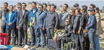  ?? — AP ?? In remembranc­e: Relatives of Ethiopian Airlines Boeing 737 MAX 8 victims paying their last respects near the scene of the crash in Bishoftu, south-east of Addis Ababa.