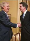  ?? Chip Somodevill­a / Getty Images ?? Senate Majority Leader Mitch McConnell greets high court nominee Brett Kavanaugh.