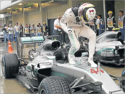  ?? Picture: REUTERS ?? VICTORY JIVE: Ecstatic Mercedes driver Lewis Hamilton, of Britain, celebrates after winning the race