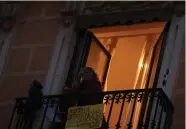  ?? (Susana Vera/Reuters) ?? BEATRIZ ‘BETTA’ BERODIA sings from her balcony in Madrid, Spain, last Thursday.