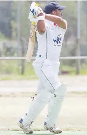  ??  ?? Yashan Samarasing­he sends this ball to the boundary on his way to a valuable 54 for Longwarry.