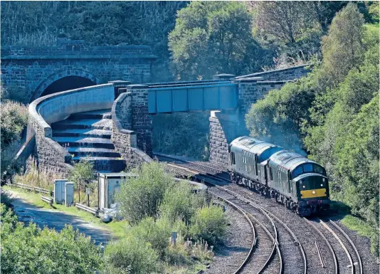  ?? MICHAEL ANDERSON ?? LSL Class 37s Nos. D6817 (37521) and D6851 (37667) exit the eastern portal of Standedge Tunnel, West Yorkshire, on September 20, as they work light engine from Crewe to York NRM to move A4 No. 60007 to York Carriage Sidings in readiness for the steam loco to be moved by road to Crewe (see also Steam News).