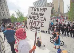  ?? REUTERS ?? A protester holding a placard against Donald Trump at the Republican National Convention, Cleveland, United States, July 21