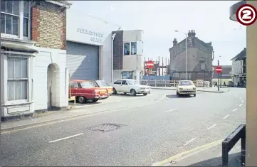  ?? ?? 1976 - Park Road (now obliterate­d by Park Mall shopping centre) is seen here in the mid 1970s with one-time businesses like Folkestone Glass (pictured left) and the New China City Restaurant (pictured right). Castle Street can be seen in the background