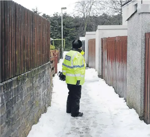  ?? Picture: Kim Cessford. ?? A police presence at Hazel Court where the body of John Donachy, 26, was found on Saturday.