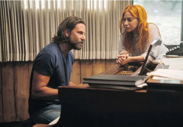  ?? WARNER BROS. ?? A Star Is Born actor-director Bradley Cooper, seen with co-star Lady Gaga, says he was interested in telling a love story through song in the latest version of the movie.