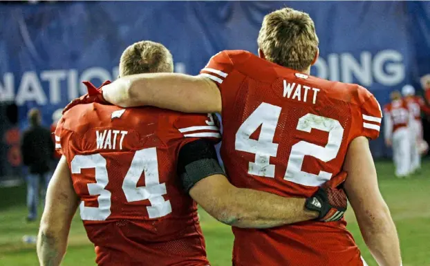  ?? David Stluka/Wisconsin Athletics ?? T.J., right, and Derek Watt leave the field after what they thought would be their final game together — a Wisconsin victory vs. Southern California in the 2015 Holiday Bowl.
