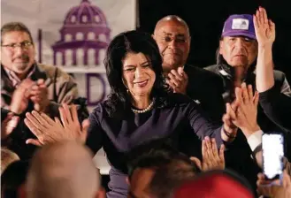  ?? Michael Wyke / Contributo­r ?? State Rep. Carol Alvarado high-fives attendants at her watch party Tuesday at Raven Tower. Alvarado received 50.4 percent of the vote in unofficial returns.