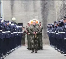  ??  ?? Thomas Kent’s remains being escorted from the grounds of Cork Prison in 2015.