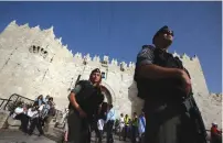  ?? (Marc Israel Sellem/The Jerusalem Post) ?? BORDER POLICE patrol yesterday in front of Jerusalem’s Damascus Gate. Notwithsta­nding the US Consulate’s warning to American citizens to avoid visiting the Old City on Sunday, Jerusalem Day passed uneventful­ly.