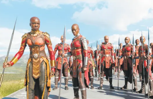  ?? Marvel Studios ?? Okoye (Danai Gurira, left) and Ayo (Florence Kasumba) of the Dora Milaje, or armed forces, in “Black Panther.”