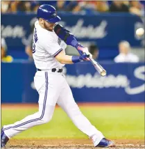  ?? Canadian Press photo ?? In this Aug. 15, 2017, file photo, Toronto Blue Jays’ Josh Donaldson hits a three-run home run against the Tampa Bay Rays in Toronto.