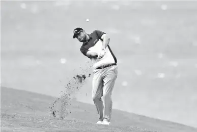  ?? Associated Press ?? Marc Leishman hits from the fourth fairway during the first round of the Tournament of Champions golf event Thursday at Kapalua Plantation Course in Kapalua, Hawaii.