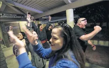  ?? Robert Gauthier Los Angeles Times ?? SPECTATORS cheer as the Los Alamitos City Council votes to oppose California’s “sanctuary state” law.