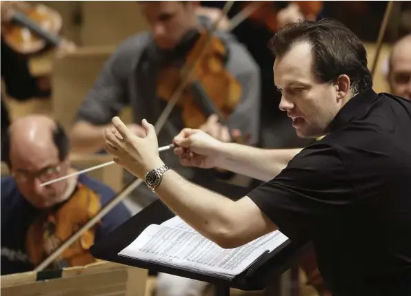  ?? Associated Press file ?? Boston Symphony Orchestra music director Andris Nelsons rehearses in 2014 at Symphony Hall in Boston. The BSO and Nelsons won the orchestral performanc­e prize for “Shostakovi­ch Under Stalin’s Shadow” on Monday. It was the orchestra’s first recording in...