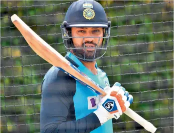  ?? — AFP ?? India’s Rohit Sharma prepares to bat in the nets during a training session at the Sydney Cricket Ground on Wednesday, ahead of the third Test against Australia.