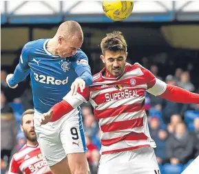  ??  ?? Rangers’ Kenny Miller (left) was taken off at half-time.