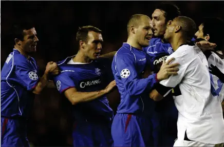  ??  ?? Bob Malcolm squares up to Inter’s Adriano as Rangers draw 1-1 in the 2005 Champions Cup group stages