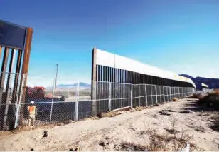  ?? PHOTO: ?? President Trump signed directives to build a wall along the 2,000-mile U.S.Mexican border and strip federal funding from “sanctuary” cities that shield illegal immigrants, as he charged ahead with sweeping and divisive plans to transform how the United...