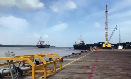  ?? Luc Cohen/Reuters ?? Vessels carry supplies from a dock near the Guyanese capital, Georgetown, to an offshore oil platform operated by ExxonMobil. Photograph: