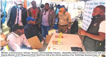  ?? ?? Minister of Environmen­t, Climate, Tourism, and Hospitalit­y Industry , Nqobizitha Ndlovu (seated second from left) and Deputy Minister of ICT Dingumuzi Phuti (third from left) at the official opening of the Beitbridge Business Expo