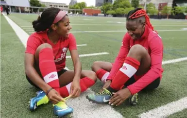  ?? RICHARD LAUTENS/TORONTO STAR ?? Ashley Lawrence, left, and Kadeisha Buchanan will play their first FIFA Women’s World Cup match tonight in Edmonton as Canada faces China. At left, the players in their younger years. Both now attend West Virginia University.