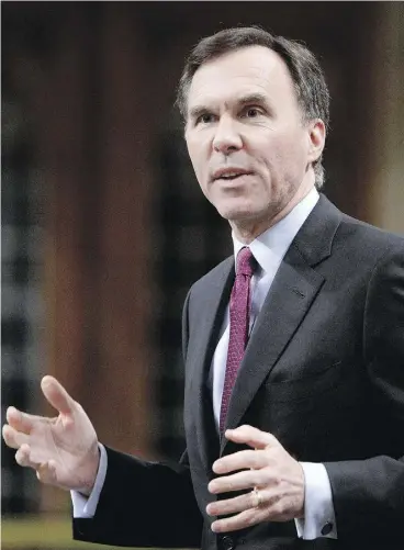  ?? ADRIAN WYLD / THE CANADIAN PRESS ?? Finance Minister Bill Morneau during question period Tuesday. Morneau said neither
raising taxes nor cutting spending “are alternativ­es that we think make sense.”