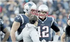  ?? THE ASSOCIATED PRESS FILES ?? New England Patriots tight end Rob Gronkowski, left, is assisted from the field after suffering a concussion in the AFC championsh­ip game on Jan. 21.
