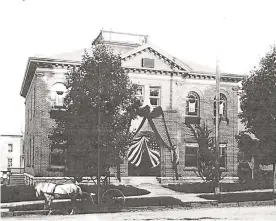  ?? The News-Times / Contribute­d photo ?? The last known photo of Town Hall with its widow’s walk, which was recently restored by a local architect and a contractor, was taken during President William McKinley’s funeral in the early 1900s. Photos after that show Town Hall without the widow’s walk, leading historians to believe it was either taken down, fell off or was lost during that time.