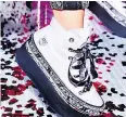  ?? — NIKE ?? Among the offerings Miley Cyrus is offering is the Chuck Taylor All Star Platform High Top.