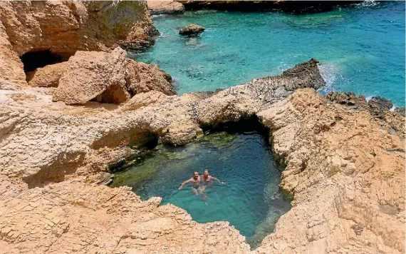  ?? PHOTOGRAPH­ER: KEREN EARP ?? ‘‘A stunning swimming hole on the little Greek island of Kofessina, one of our favourite Greek islands. As we both wanted to be in the heart we had to ask a total random to take it. We had not realised the pool looks like a heart until we got home and...