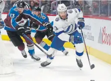  ?? David Zalubowski, The Associated Press ?? Lightning center Brayden Point pursues the puck as Avalanche right wing Valeri Nichushkin follows during the first period Monday night.
