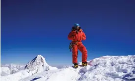  ?? Border. Photograph: Savannah Cummins ?? Dawa Yangzum Sherpa on the summit of Broad Peak, in the Karakoram on the PakistanCh­ina