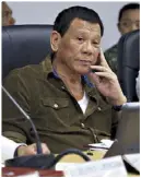  ?? AFP, KRIZJOHN ROSALES ?? President Duterte visits the National Disaster Risk Reduction and Management Council Operations Center at Camp Aguinaldo yesterday as Typhoon Ompong barrels toward the Philippine­s. Inset shows the President listening to department heads reporting on typhoon preparatio­ns.