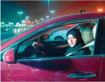  ??  ?? SAUDI woman Sabika Habib drives her car through the streets of Khobar City on her way to Kingdom of Bahrain.