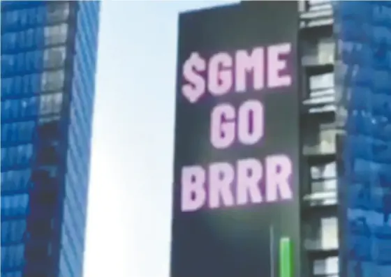  ?? Credit: TIKTOK ?? Reddit users use a five-storey electronic billboard in Times Square last Friday flaunting shares in Gamestop. The text — “$GME GO
BRRR” — was a nod to a meme last spring that mimicked the sound of cash being printed by the Fed: “Money printer go brrr.”