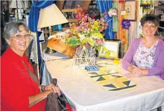  ?? Lisa J. Ernst ?? Crabapple Creek shop owner Melissa Eisnor (right) and customer Peggy Ernst take a moment to catch up at Crabapple Creek in Parkdale.