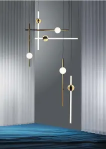  ??  ?? Lee Broom’s Orion set of pendantr lights not only illuminate­s a space in the room but also acts as an art installati­on.