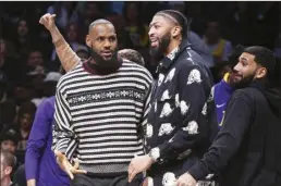  ?? AP photo ?? Lakers forward LeBron James and forward Anthony Davis look on from the bench during the second half against the Brooklyn Nets on Jan. 30.