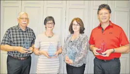  ?? CAROL DUNN/THE NEWS ?? From left, Eric LeBlanc, Shirley MacKay and Sheri MacLeod, representi­ng the East Coast Credit Union, received awards from the Pictou County Fuel Fund at its annual general meeting last week. They are shown with PCFF chairperso­n Jim McKenna, holding one...